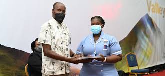 Cecil Calliste donates laptops to students at USC