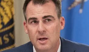 GOP Governor Criticized Over Dead Bobcat in Bare Hands, “Y'all Gonna Eat  That?”