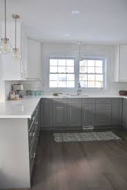 Love The Two Tone Painted Cabinets In This Kitchen They Gray And White Mix Is P White Ikea Kitchen White Kitchen Makeover Classic Kitchen Design