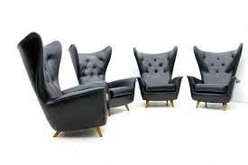 four black leather wing lounge chairs 1950s lounge chair leather wingback modern lounge chairs