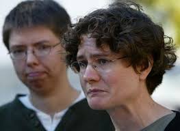 Lesbian minister is defrocked for having gay partner