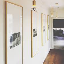 Black And White Gallery Wall Prints Lori Paranjape On Instagram Passages Interiordesign Interior Art Photography Blackandwhite Brass Wall Decor Living Room Hallway Decorating Cool Walls