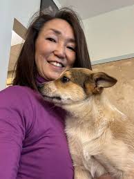 Hi all! I just wanted to share a photo of my beagle/blue heeler mix, Grace;  this is her being a cuddle bug and HEALer (lol)