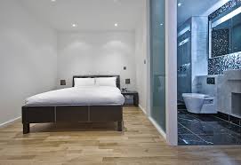 Especially in the master bedroom where designers from svoya studio decided to use glass wall panels in order to separate bedroom from the bathroom. Glass Bathroom Walls For Master Suite Separation