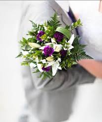 With the fluffy blooms available in white, cream, yellow, and varying shades of pink and red, peonies are the perfect addition to all bridal bouquets. White And Purple Winter Wedding Bouquet Lds Wedding Planner