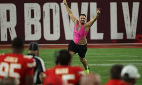 The crew from danish tv 2 uses their own camera in the booth to record the streaker as he runs across the field. Zhsqy6xccs2b5m