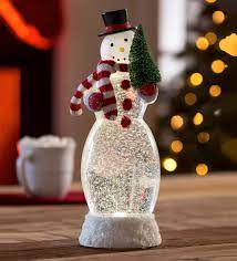 Surrounded by swirling glitter, when turned on a warm led shines down on the figurine to give our. Led Snowman Snow Globe Wind And Weather