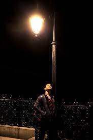 Man Standing On Street Light Photo Free Human Image On Unsplash Night Street Photography Night Photography Portrait Night Time Photography
