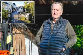 We're prisoners in our homes after neighbour installed barbed wire gates  and blocked us from driving out at night