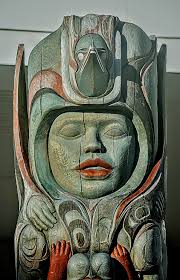 Chief-of-All-Women pole, the Tlingit totem pole, in Pioneer Square... 1st  Ave. It is one of the few totem poles dedicated to a woman. Please pardon  the smudges...Snapped this en route north... through