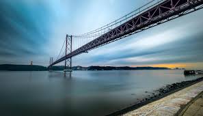 Things to do in lisbon, portugal: 25th April Bridge Lisbon Lisbon Bridges Portugal Travel Guide