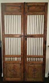 beautiful spanish gates from inside historic adobe home used in doorway from the living room to the kitchen home w celebrity houses spanish doors adobe house