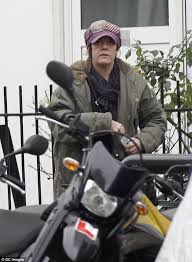 Ex-EastEnders actress Elaine Lordan downs a bottle of wine out in public