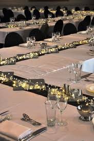 We created custom gorgeous white wave tables and covered his whole formal living room with black and white striped carpet. Theming Idea Elegant Black And White Dinner With Unique Table Format