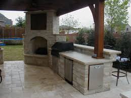 outdoor fireplace with covered tv