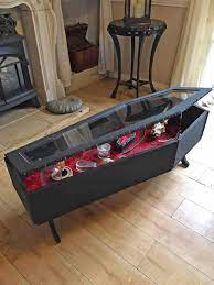 These free coffee table plans will help you build a wonderful centerpiece for your living room that looks great and is very functional. This Coffin Coffee Table Opens Up To Store Your Dark And Creepy Decor Items