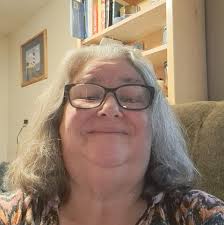 Here are two photos of the blue metal suitcase that ended up in my living  room, serving as a stand for some plants. This is the very suitcase that  held the *Drive-In