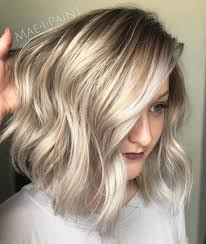 As the bangs frame the face from the top, the hair is casually tousled on the shoulder on one side, resulting in a subtle and natural look. 40 Styles With Medium Blonde Hair For Major Inspiration