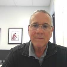 John “Skip” Holland