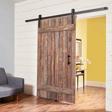 The wooden track will make the entire project more cohesive. How To Build A Simple Rustic Barn Door Diy Family Handyman