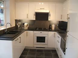 A favourite with our customers is the millennia granite worktop; Monotone Colour Scheme Black Tiles Kitchen White Gloss Kitchen White Kitchen Units