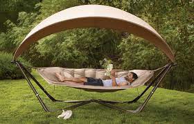 Hammock stand with hammock and canopy makes a great addition to your yard, patio, or wherever you want to hang out. Bliss Hammock Pod W Canopy Lets You Relax Outside Hammock With Canopy Poolside Furniture Hammock Stand