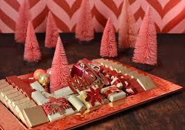 Tis The Season For Our Iconic Chocolate Gift Arrangements Christmas Arrangements Christmas Chocolate Christmas Rock