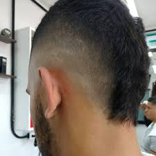 Hair that is shaved or buzzed on the sides leaving a strip of hair in the middle. Best Mohawk Fade Haircut Agenda Tu Realfactsbarbershop Facebook