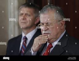 Iraqi President Jalal Talabani, right, and Poland's Prime Minister Marek  Belka comment