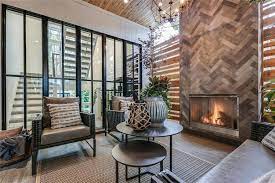 trickle creek homes custom home the maxwell modern farmhouse home outdoor living room gas fireplace wood ceiling patio furni modern farmhouse house styles home