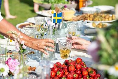 A traditional Swedish Midsummer outdoor feast spread.