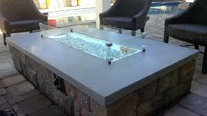 This table features durable steel construction with a top that is wide enough for drinks to rest on while you and your guests enjoy the warm flame. Fire Custom Industries