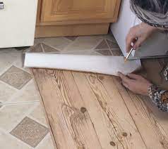 However, you may opt to apply caulking around the cut edges in cases where there is a lot of water and humidity involved like in a kitchen or bathroom. Apartment Friendly Faux Wood Floors With Contact Paper Hometalk