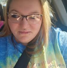 What color suit would be suitable for a fall wedding with a color palette  of terracotta, burgundy, and paprika?