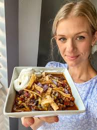 Taco chili 1. Take 2 cans black beans, 1 can kidney beans, I can pinto  beans; drain and rinse them. Throw into your crockpot. 2. Add I can  tomatoes with green chilies