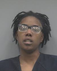 Woman arrested after allegedly setting car