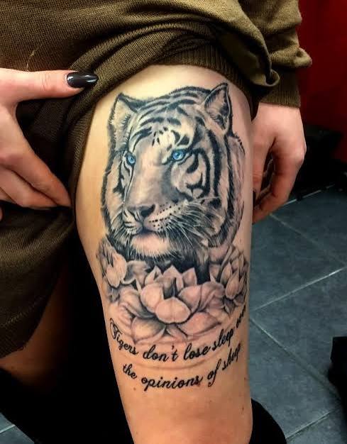 Tiger and Lotus Tattoo Design | Tiger tattoo ideas, Traditional tiger tattoo, A tiger tattoo