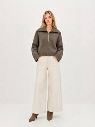 Beige wool sweater with zip-up high collar