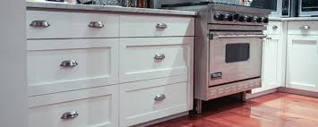 A reface done in cherry hardwood with glazing would cost much more than in white laminate. Kitchen Cabinet Refacing Nyc Brooklyn Staten Island New Jersey