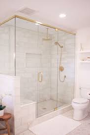White subway tile shower with patterned accent in dark bathroom with white tub and black tile flooring. 50 Cool And Eye Catchy Bathroom Shower Tile Ideas Digsdigs