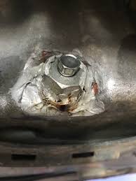 My oil drain plug was stripped from the engine oil. Customer Said You Gotta Hold The Big Nut And Loosen The Little One Never Seen An Oil Drain Plug Held In Place By Silicone Before Justrolledintotheshop