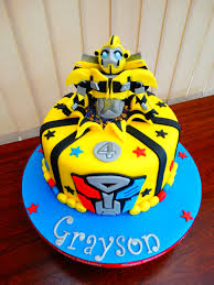 A transformers bumblebee car cake for a customer's little man's 5th birthday complete with edible handpainted transformers sign and a happy birthday sign painted in the style of the transformers. Bumblebee Transformers Cake Xmcx Transformers Birthday Cake Cool Birthday Cakes Transformer Birthday
