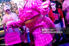 Attendee Jack Brunson wears a Barbie shirt while watching drag... News  Photo