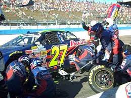 Here's how a pit stop goes crew members stand by with tires, air guns, and fuel. Joe Polish At Nascar Fast Tire Change In Pit Youtube