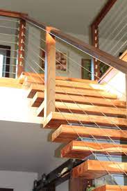 Combine The Modern Sleek Look Of Cable Railing With Wood Stainless Steel Or Aluminum Baluster Options For A Railing Design Modern Stair Railing Modern Stairs