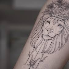 Female lion tattoo with flowers on the back. Pure Female Lion Tattoo Ideas Female Lion Tattoo Ideas In 2020