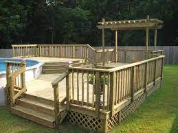 The deck supports should be screwed into the side of each interior pier that faces the pool. Oval Above Ground Pool Deck Plans Swimming Pool Decks Backyard Pool Pool Deck Plans