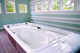 Amazing ocean life tile mural over looking this quaint but practical workout pool. Indoor Hot Tub Installations In Detail Pool Spa News