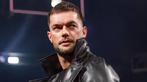 Who is WWE star Finn Balor, what is his real name, when did he become first  ever WWE Universal Champion, and how did shoulder surgery affect his  career?