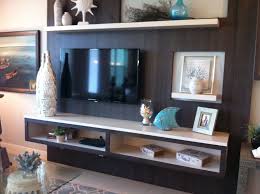 It has a wall of windows along one side. This Can Make The Tv Off Centre And Still Balance Out The Wall Living Room Redo Home Living Room Living Room Inspiration